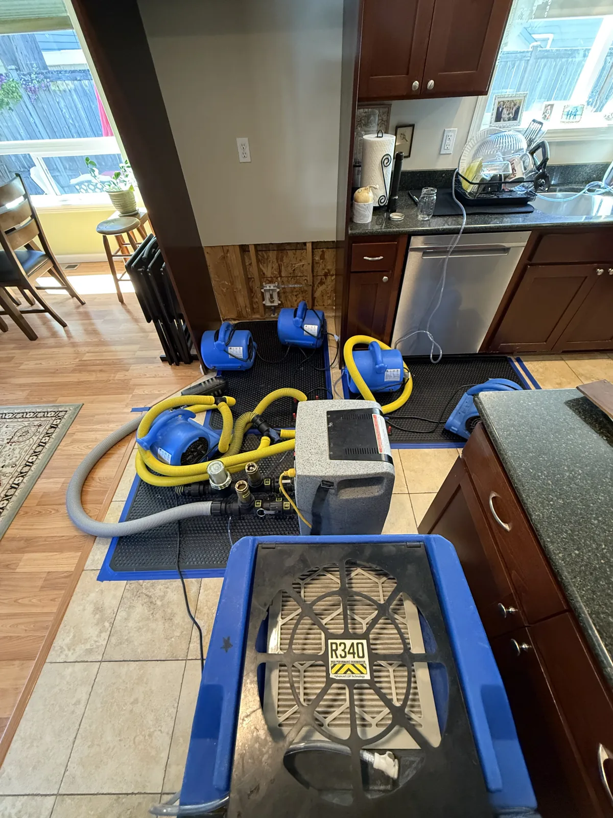 Edmonds: Drying mats, hoses, and supporting equipment treating the affected kitchen floor.