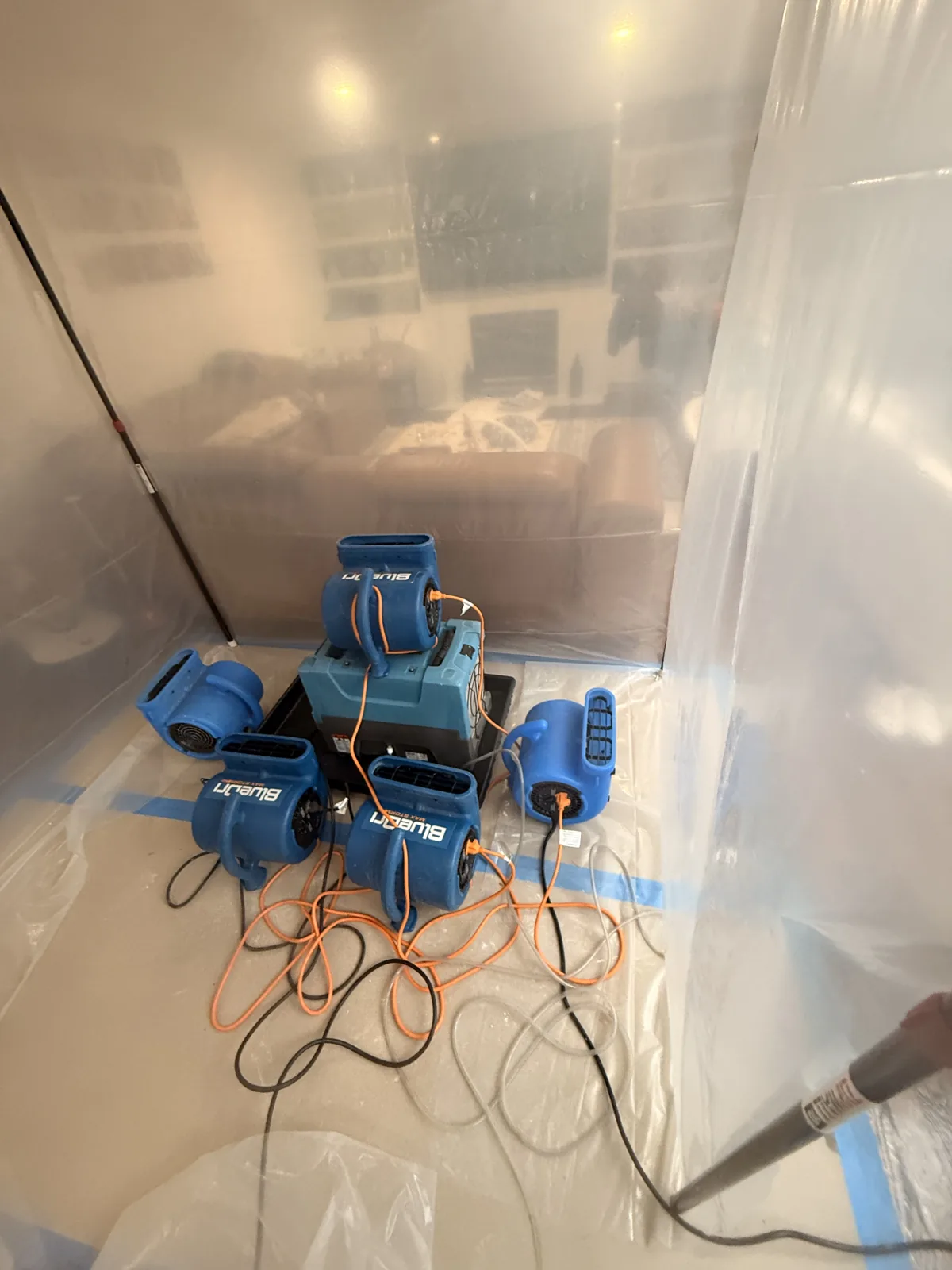 Medina: Air movers directed toward the exposed ceiling within the contained work area.