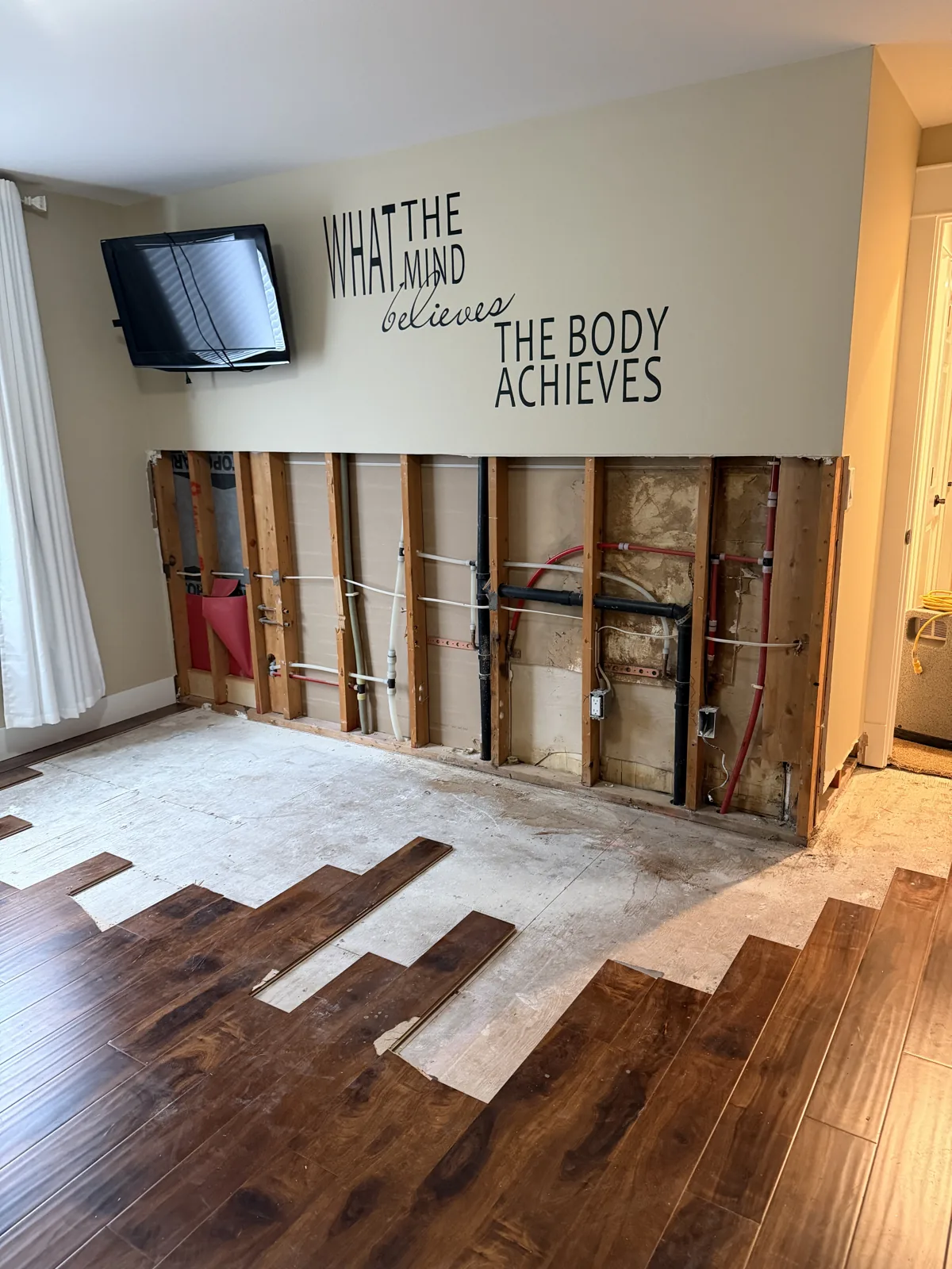 Mukilteo: The opened wall framing after equipment removal, before wall repairs.